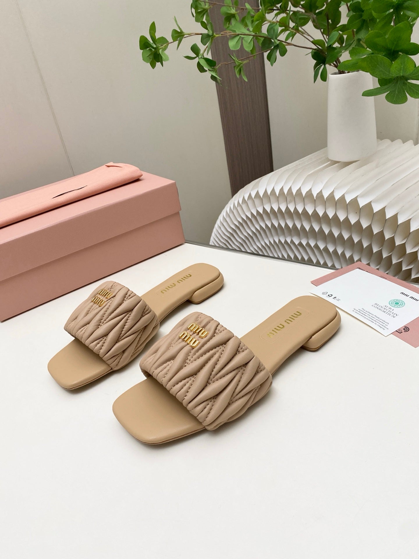 MIUMIU 26S MATELASSE SLIDES IN BEIGE CALFSKIN