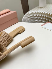 MIUMIU 26S MATELASSE SLIDES IN BEIGE CALFSKIN