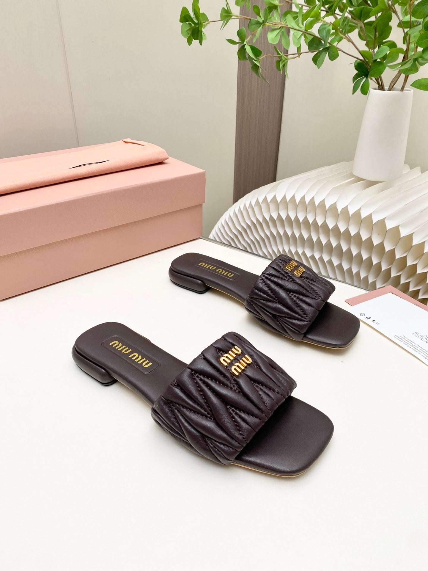 MIUMIU 26S MATELASSE SLIDES IN DARK BROWN CALFSKIN