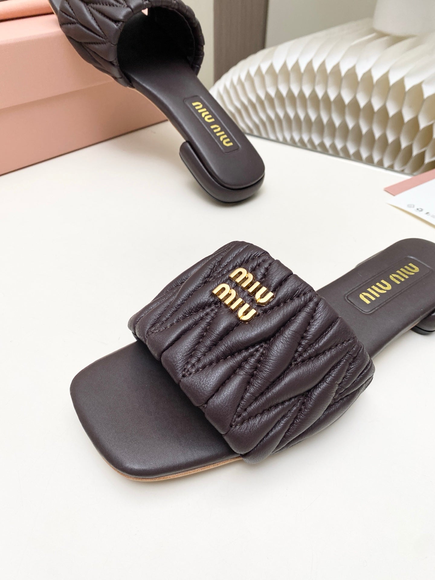 MIUMIU 26S MATELASSE SLIDES IN DARK BROWN CALFSKIN