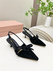 MIUMIU 26S SLINGBACK PUMPS 55MM IN BLACK SUEDE WITH BOW