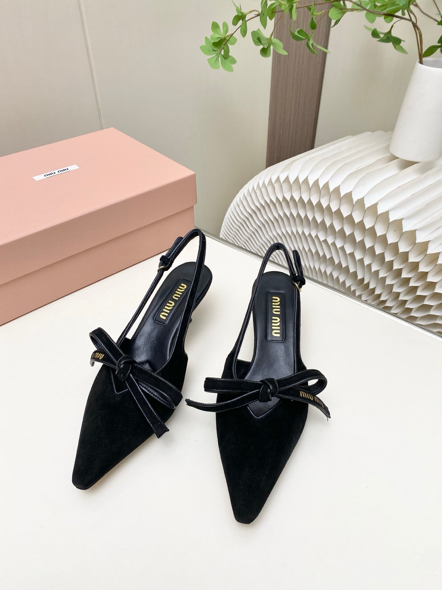 MIUMIU 26S SLINGBACK PUMPS 55MM IN BLACK SUEDE WITH BOW