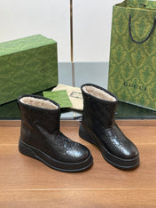 GG UGG BOOTS IN BLACK EMBOSSED DEERSKIN AND BEIGE WOOL LINING