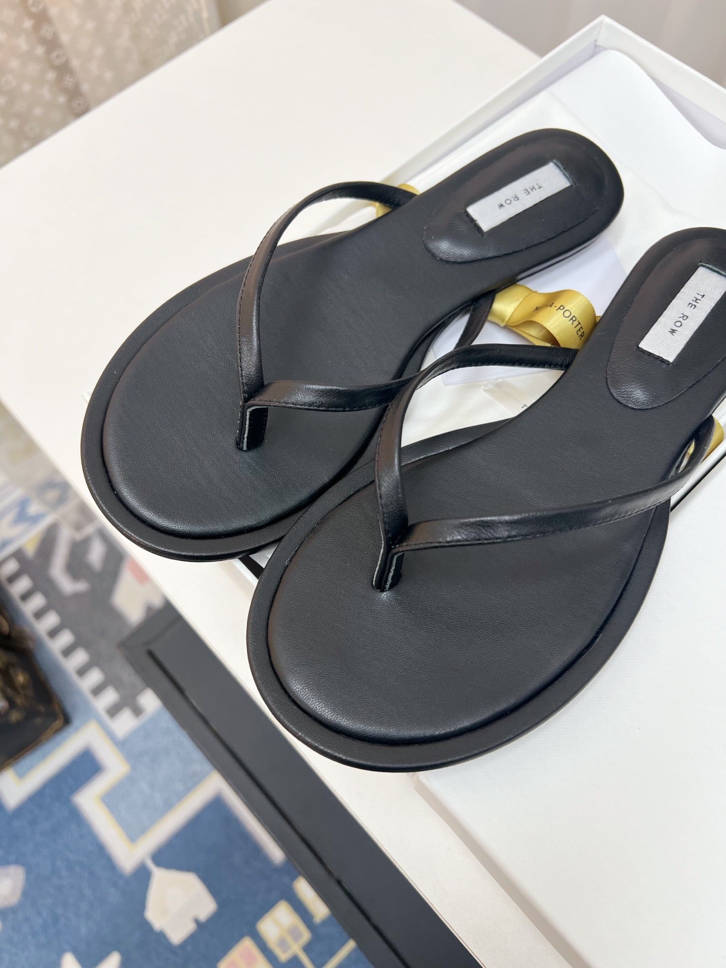 THE ROW 26S THONG SANDALS IN BLACK CALFSKIN