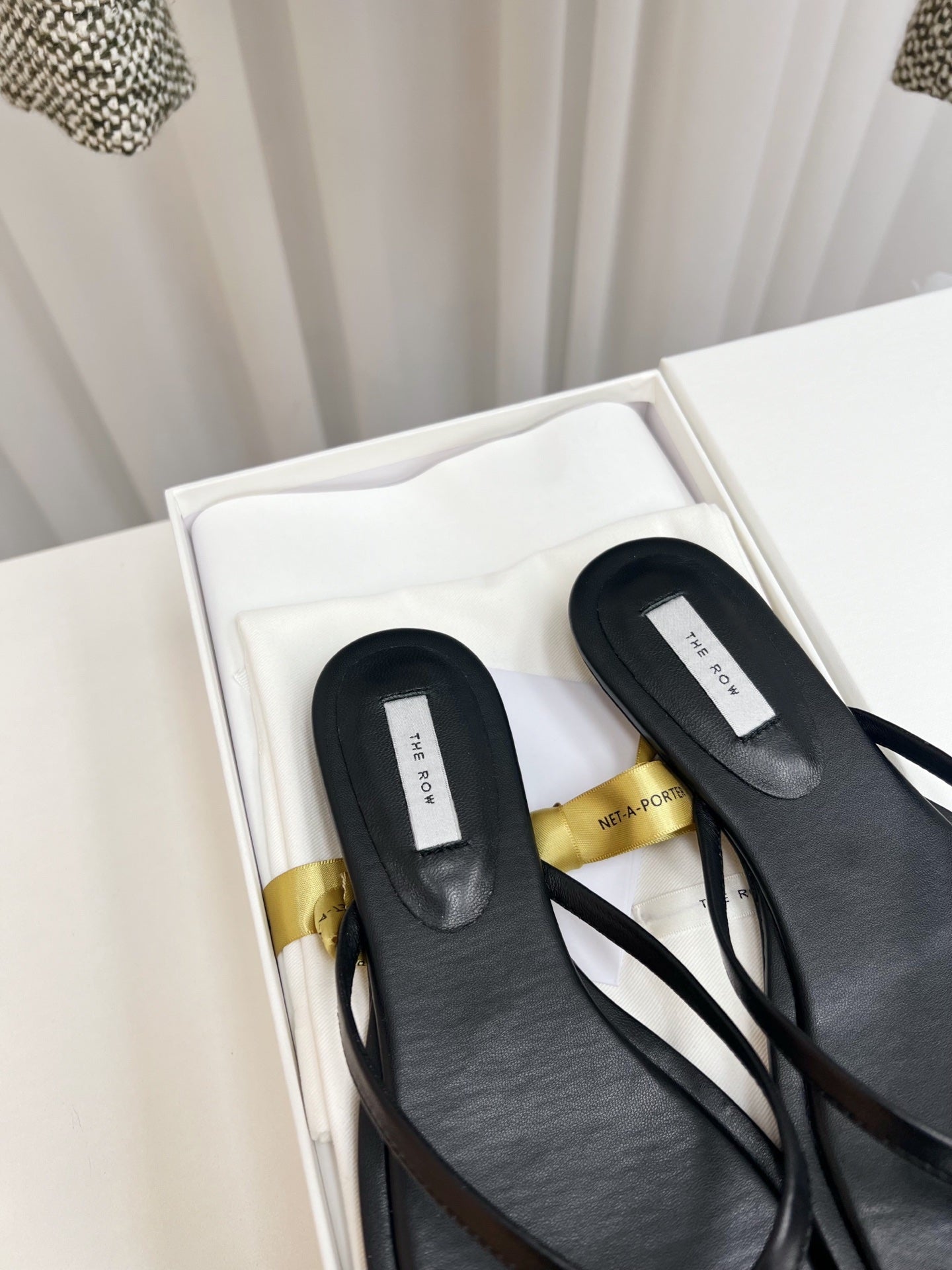 THE ROW 26S THONG SANDALS IN BLACK CALFSKIN