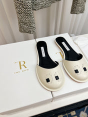 THE ROW 26S PIXEL APPLIQUE MULES IN IVORY WHITE CALFSKIN