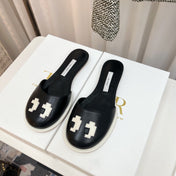 THE ROW 26S PIXEL APPLIQUE MULES IN BLACK CALFSKIN