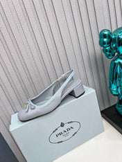 PRADA 26S ROUND TOE SLINGBACK PUMPS 40MM IN LIGHT BLUE CALFSKIN WITH BOW