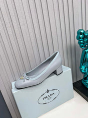 PRADA 26S ROUND TOE PUMPS BLOCK HEEL 40MM IN LIGHT BLUE CALFSKIN WITH BOW