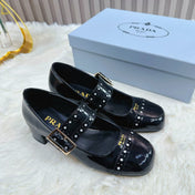 PRADA 26S ROUND TOE MARY JANE 40MM IN BLACK PATENT CALFSKIN WITH STUD DETAIL
