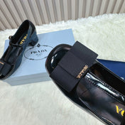 PRADA 26S T-STRAP MARY JANE PUMPS 40MM IN BLACK PATENT CALFSKIN WITH BOW