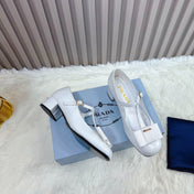 PRADA 26S T-STRAP MARY JANE PUMPS 40MM IN LIGHT BLUE PATENT CALFSKIN WITH BOW