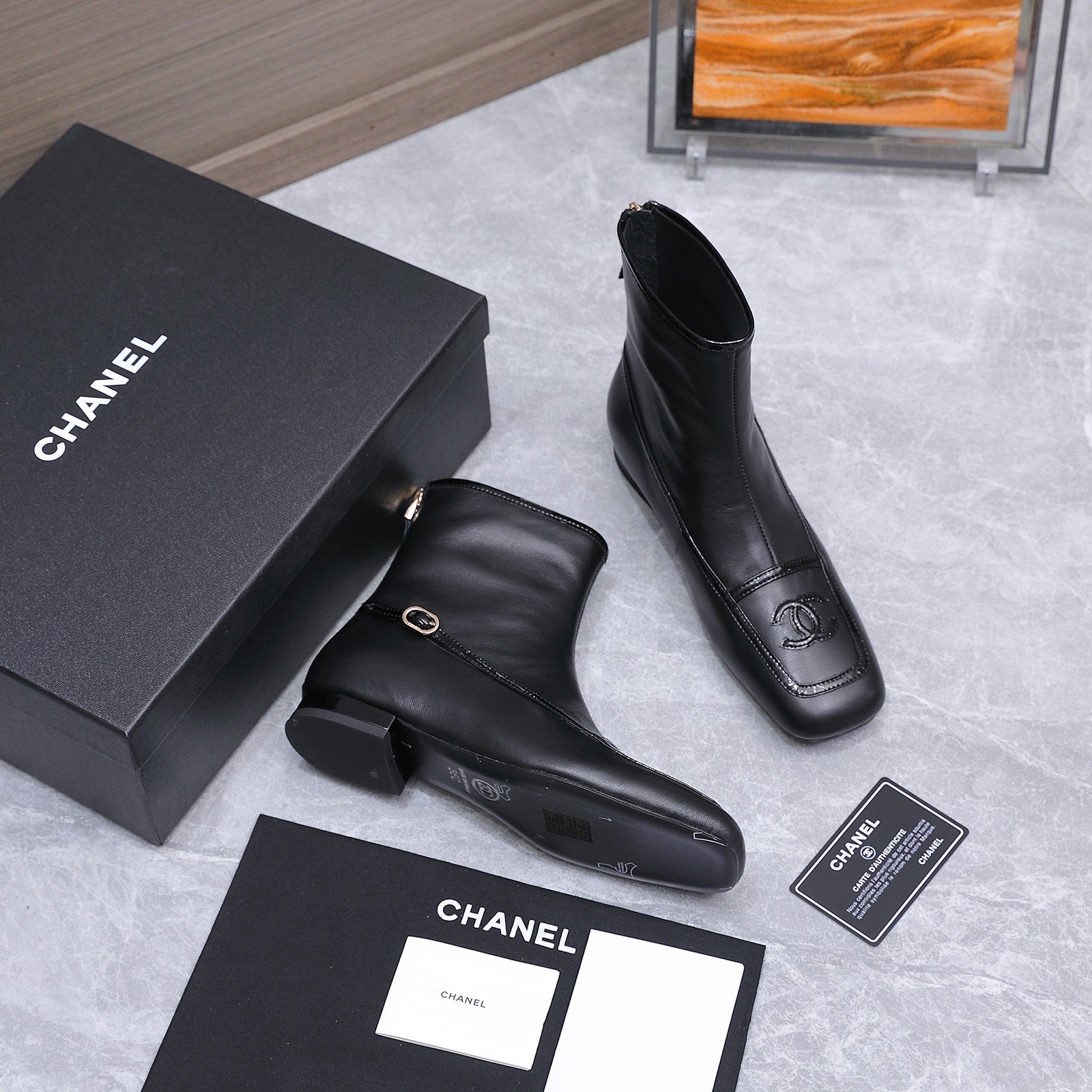 CHANEL 26S ANKLE BOOTS IN BLACK CALFSKIN WITH PATENT LEATHER TRIM AND CC LOGO ON TOE CAP