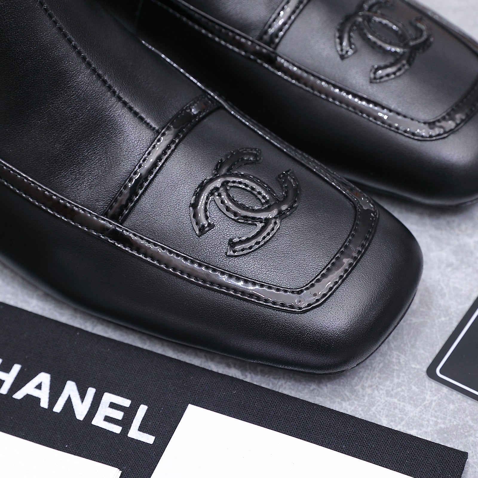 CHANEL 26S ANKLE BOOTS IN BLACK CALFSKIN WITH PATENT LEATHER TRIM AND CC LOGO ON TOE CAP