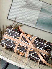 KEEPALL BANDOULIÈRE 50 IN PARFLECHE PATTERN MONOGRAM CANVAS