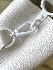 CAPUCINES EAST-WEST MINI 21 IN WHITE TAURILLON
