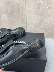 CHANEL 26S MULE LOAFERS IN BLACK QUILTED CALFSKIN WITH CC LOGO