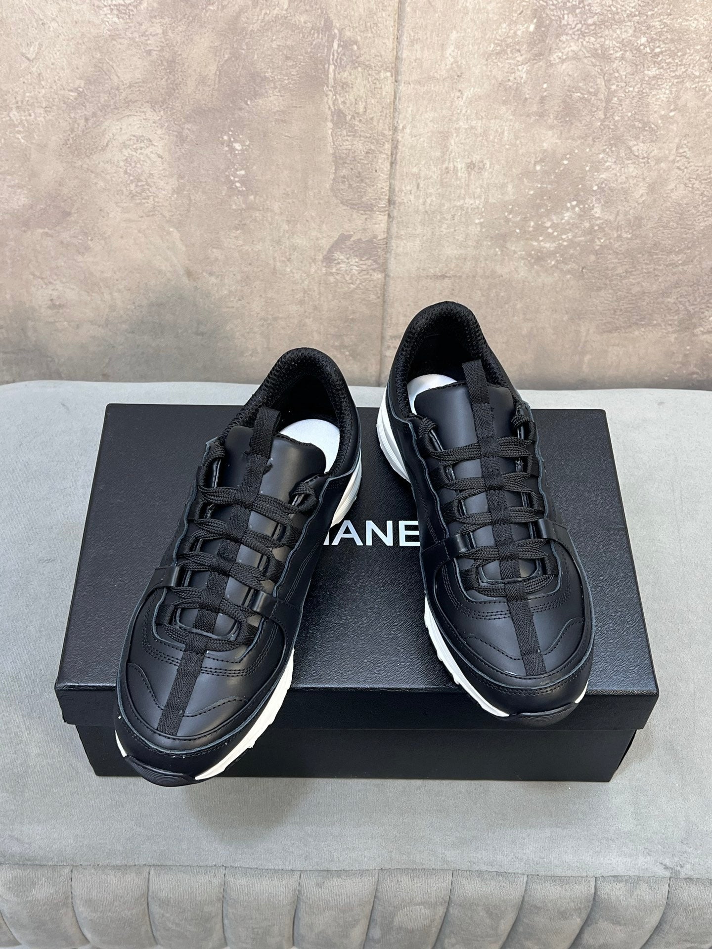 CHANEL 26S RUNNER CC LOGO SNEAKERS IN BLACK CALFSKIN