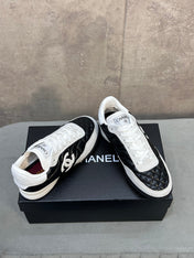 CHANEL 26S SNEAKERS IN BLACK AND WHITE QUILTED CALFSKIN CC LOGO
