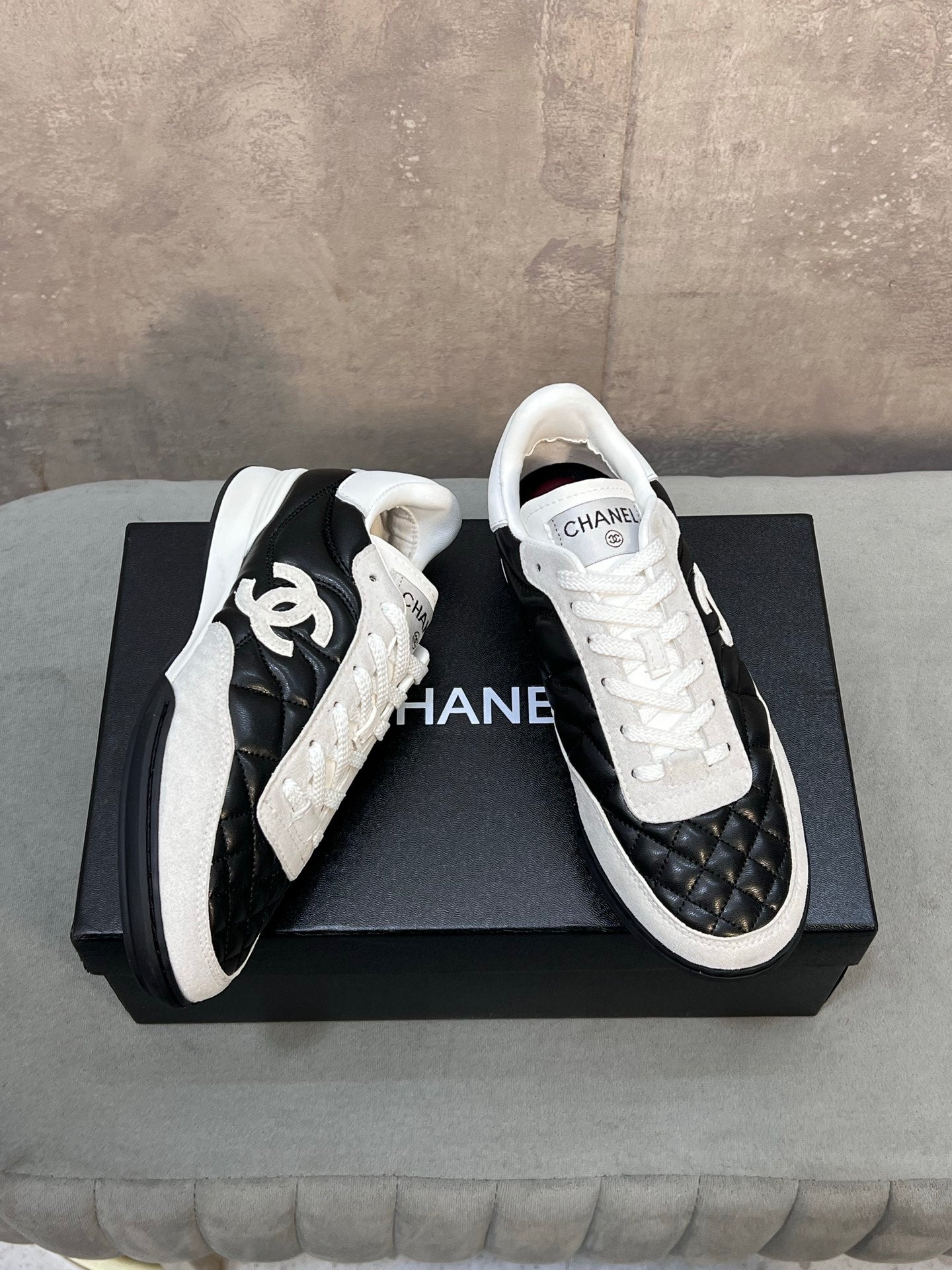 CHANEL 26S SNEAKERS IN BLACK AND WHITE QUILTED CALFSKIN CC LOGO