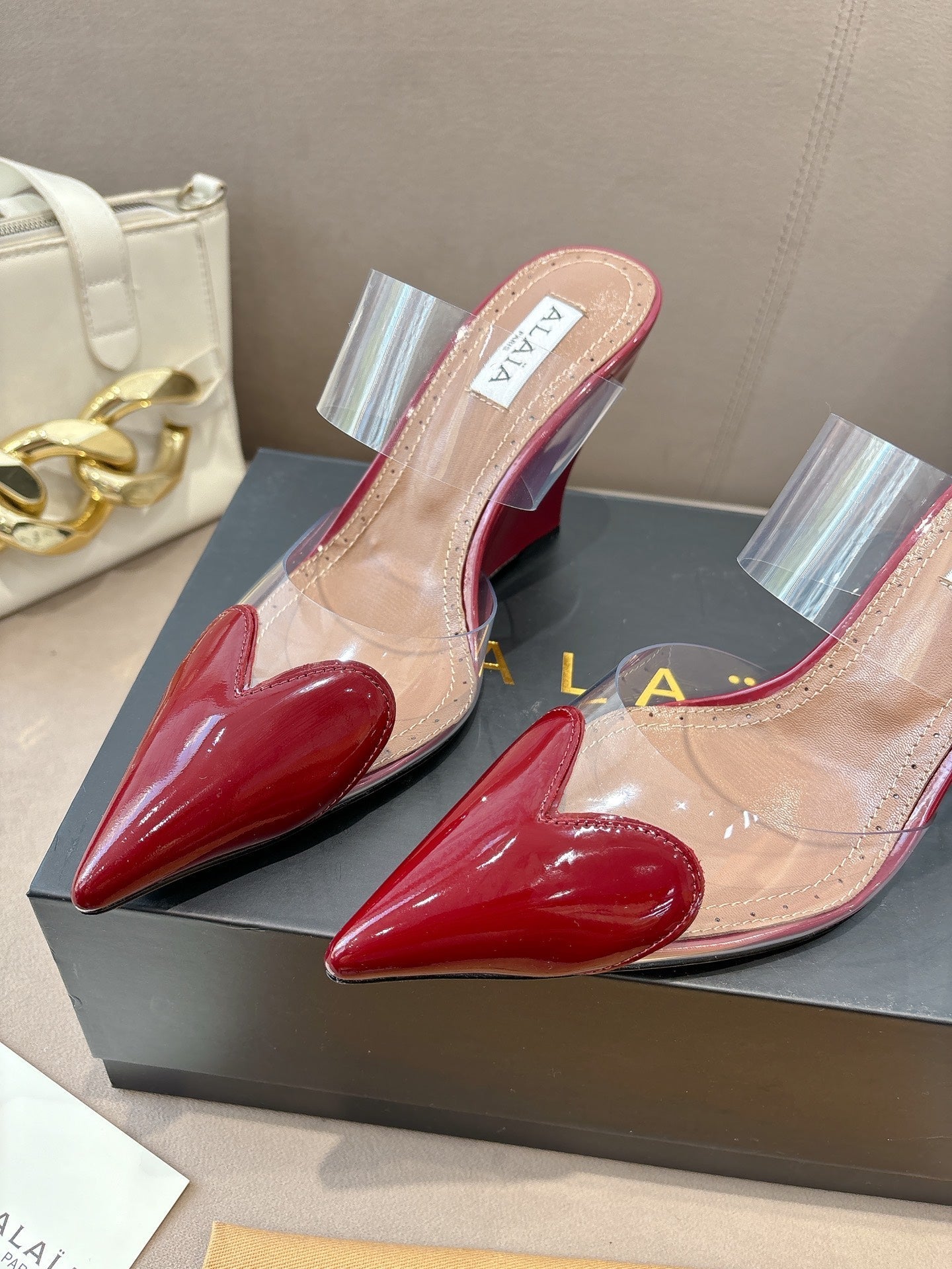 ALAIA 26S HIGH-HEEL WEDGE MULES 95 MM IN DARK RED GLOSSY CALFSKIN