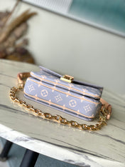 POCHETTE MÉTIS EAST WEST 21 IN GRAY CREAM MONOGRAM TRIANON CANVAS GOLD HARDWARE