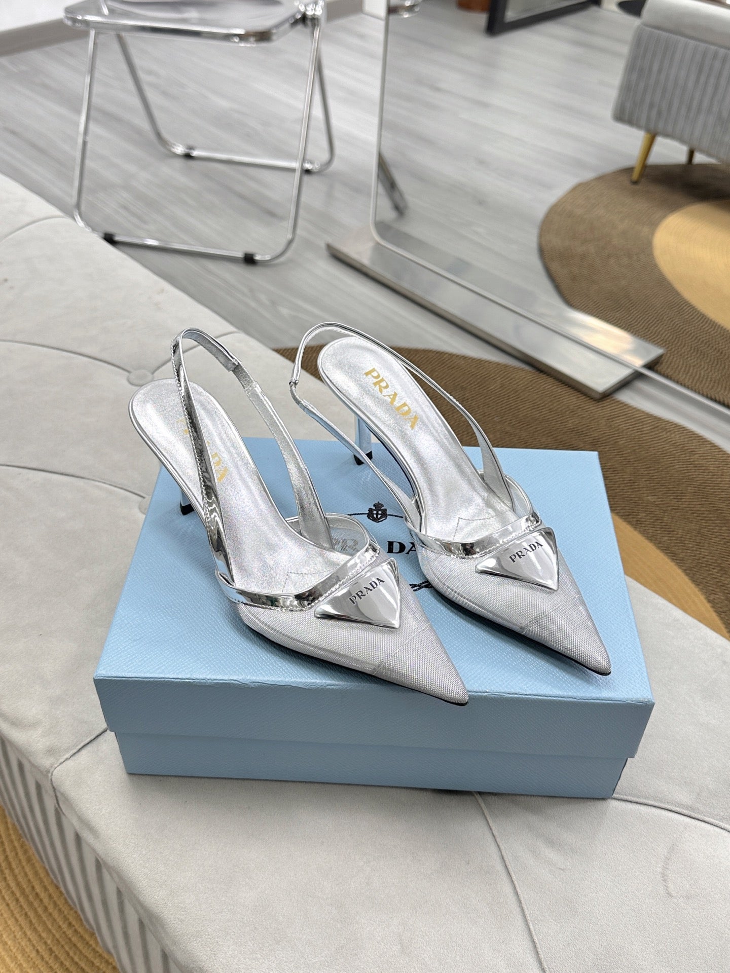 PRADA 25S TRIANGLE LOGO SLINGBACK PUMPS IN SILVER MESH FABRIC