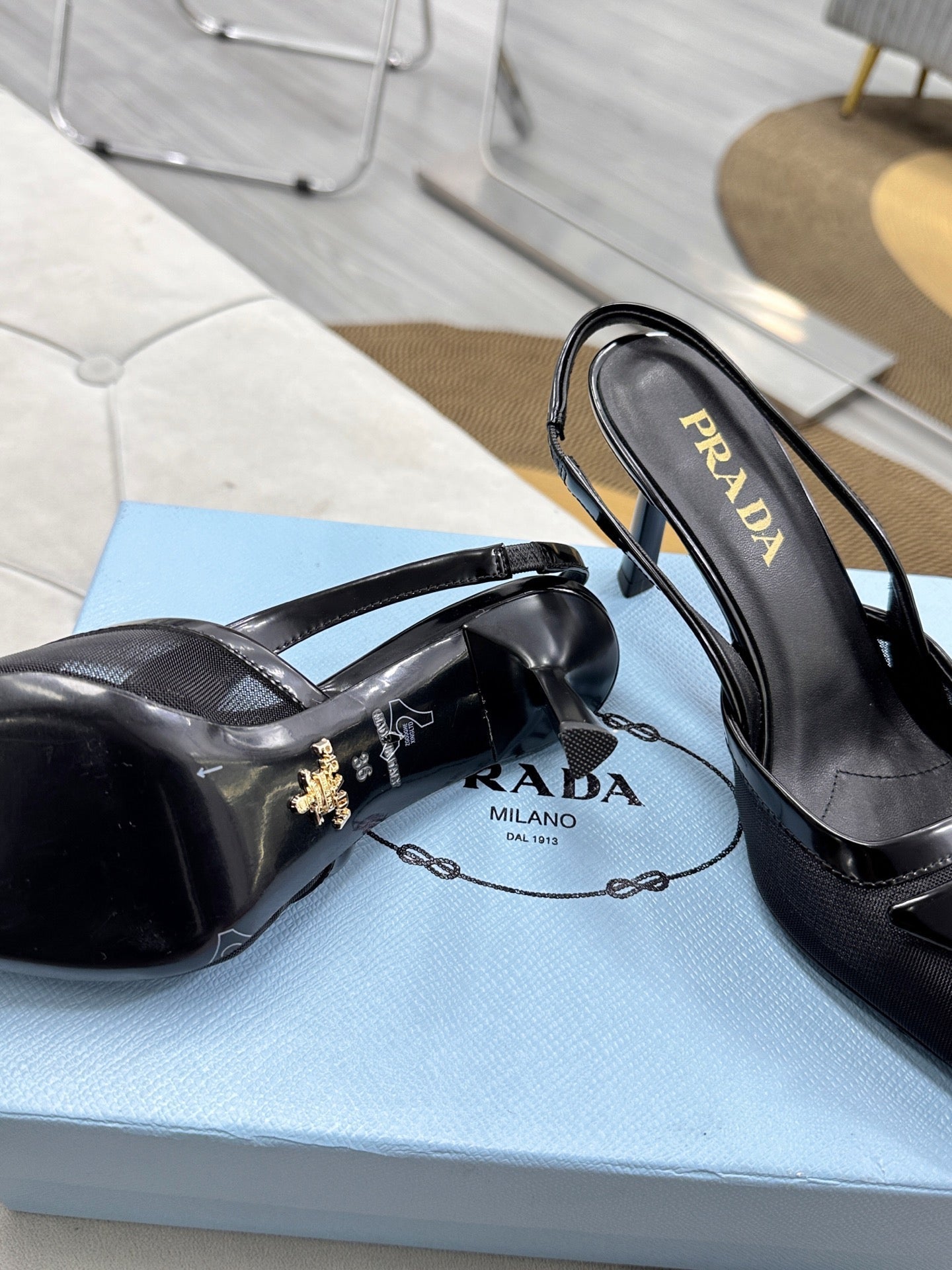 PRADA 25S TRIANGLE LOGO SLINGBACK PUMPS IN BLACK MESH FABRIC