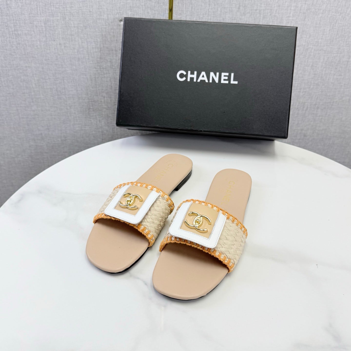 CHANEL 26S WOVEN STRAP SLIDES IN BEIGE AND ORANGE LAMBSKIN