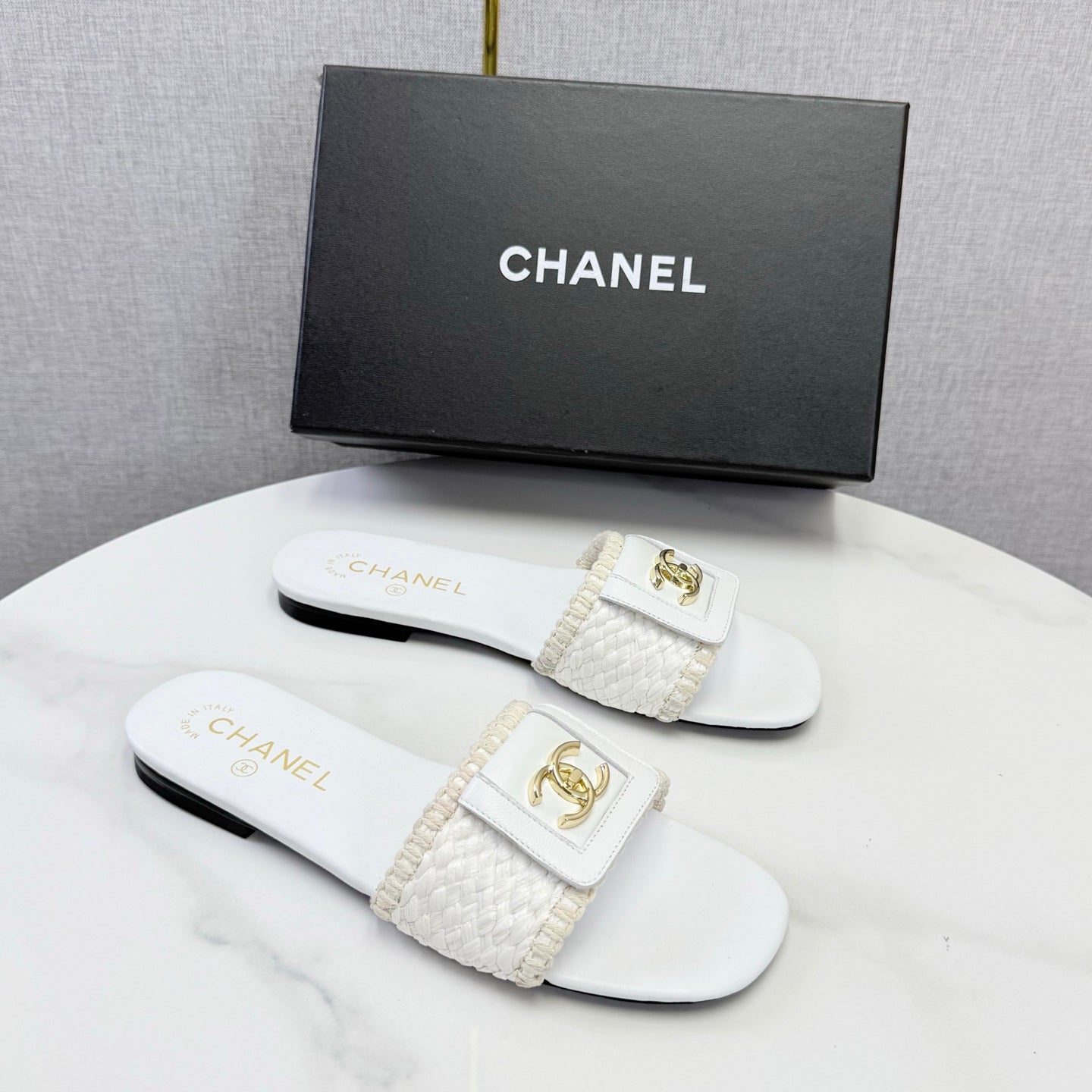 CHANEL 26S WOVEN STRAP SLIDES IN WHITE LAMBSKIN