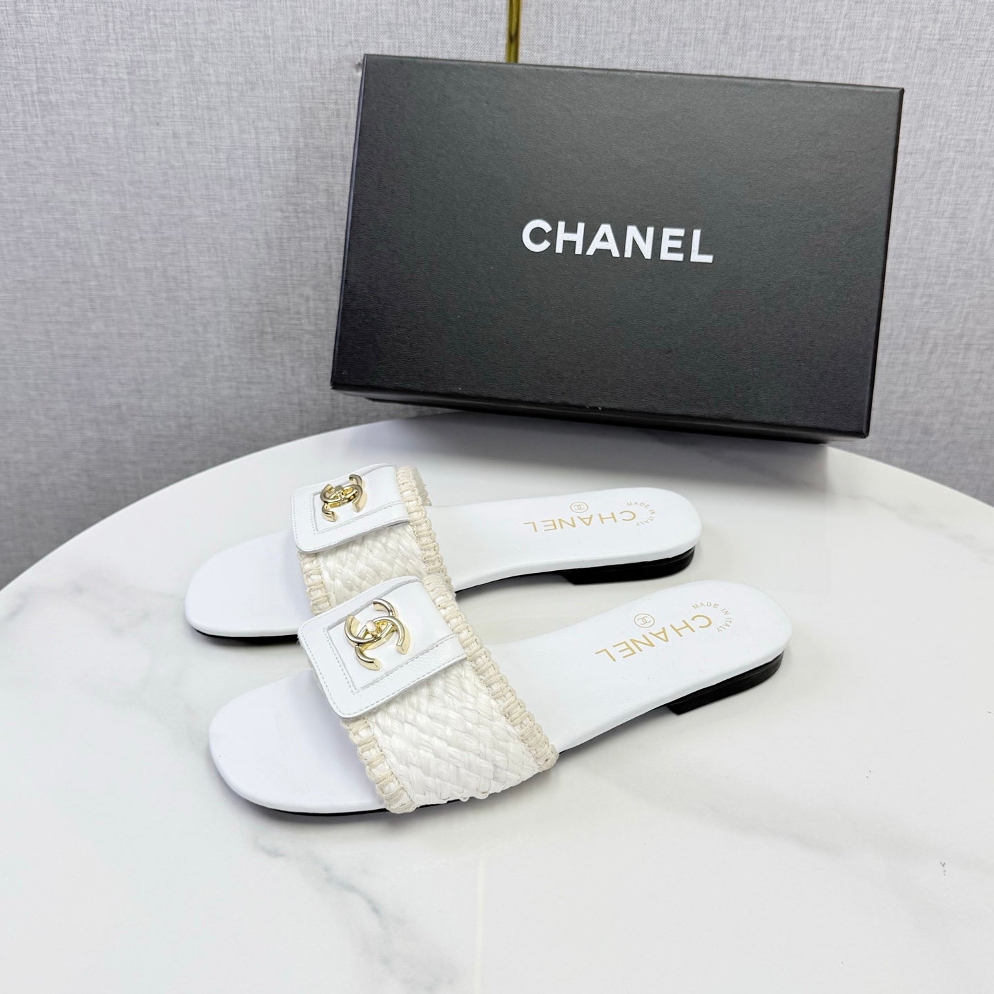 CHANEL 26S WOVEN STRAP SLIDES IN WHITE LAMBSKIN