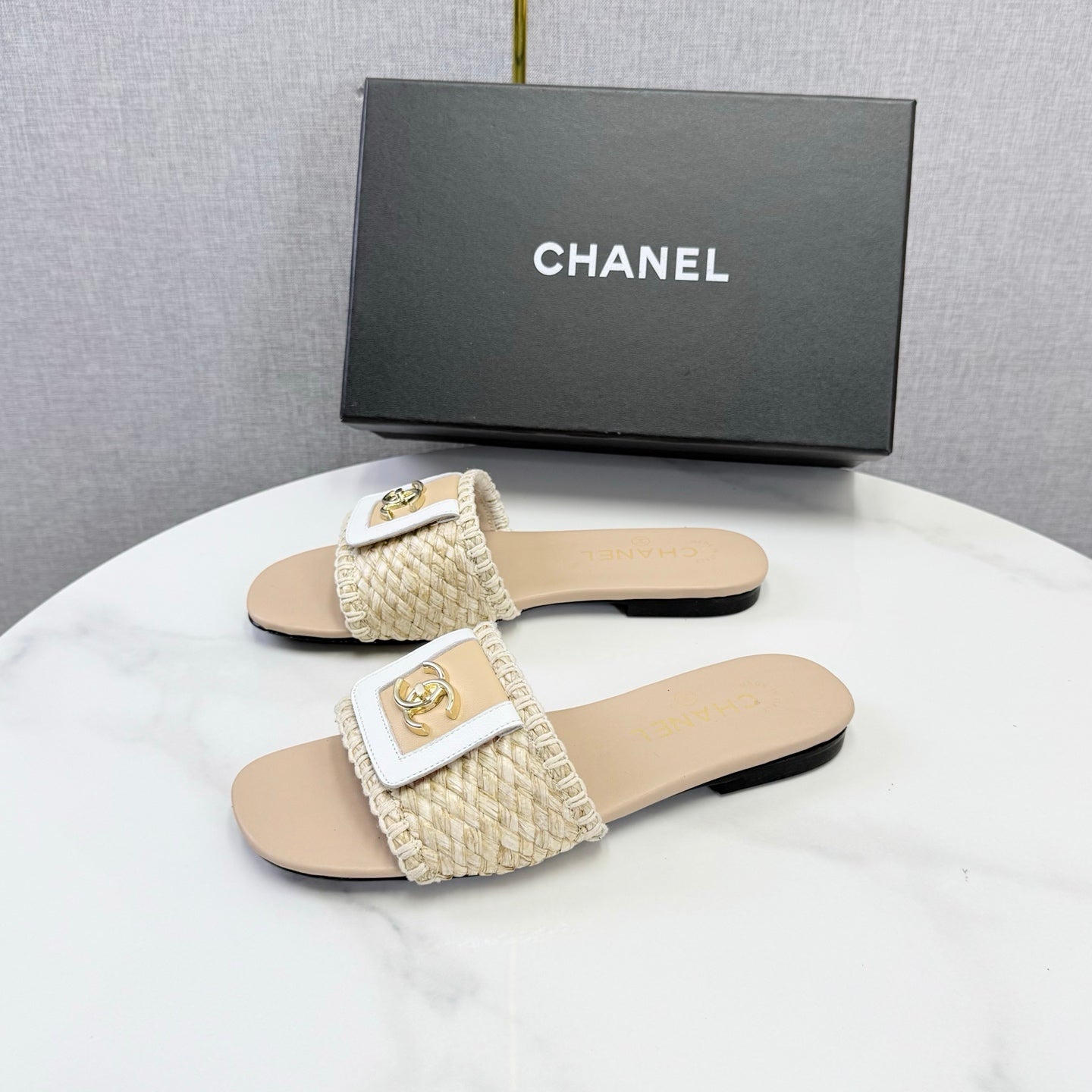 CHANEL 26S WOVEN STRAP SLIDES IN BEIGE LAMBSKIN