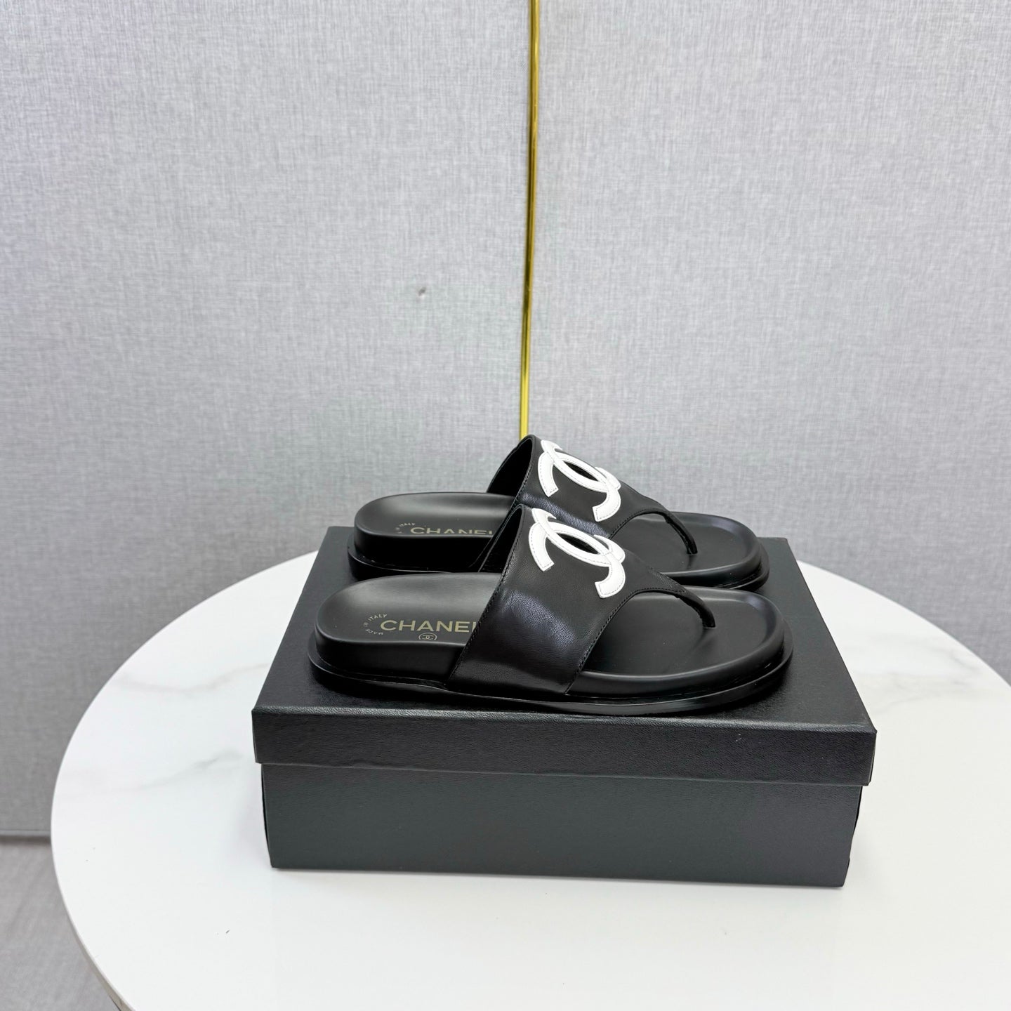 CHANEL 26S CC THONG SLIDES IN BLACK LAMBSKIN