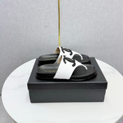 CHANEL 26S CC THONG SLIDES IN WHITE AND BLACK LAMBSKIN