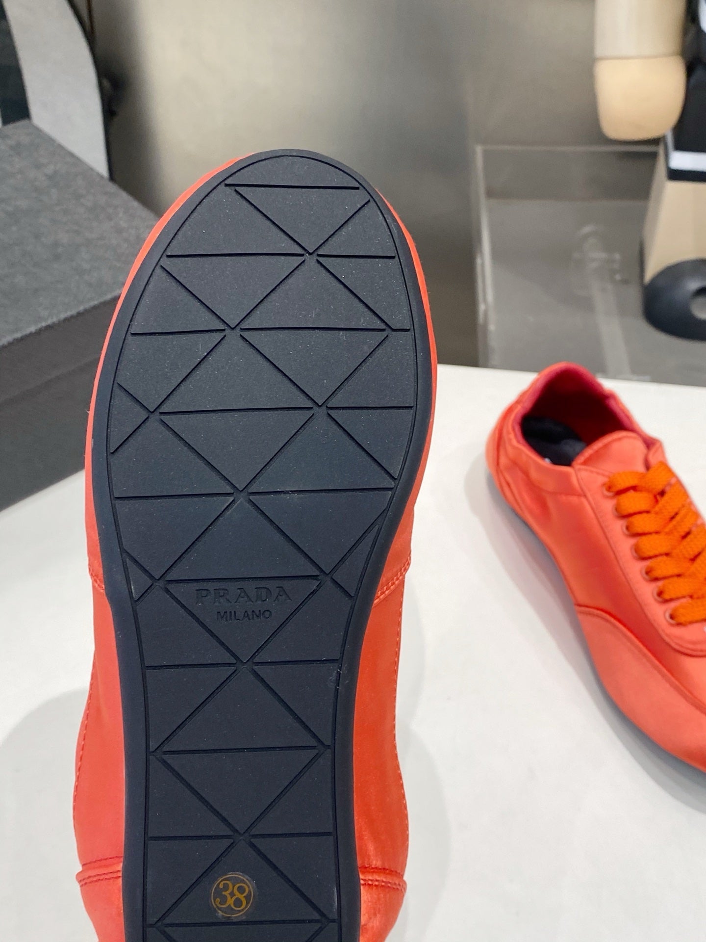 PRADA 26S SNEAKERS IN BURNT ORANGE SATIN