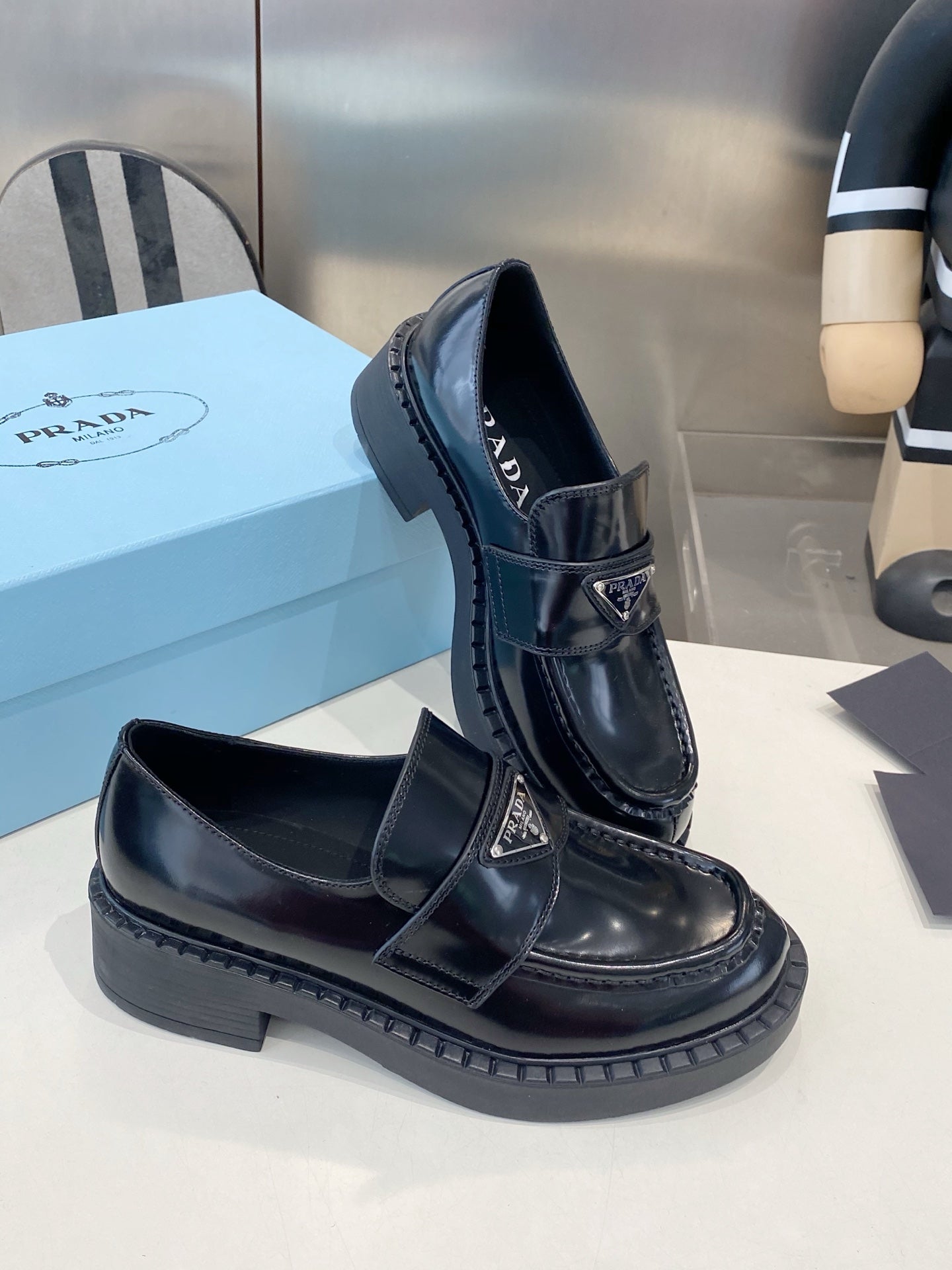 PRADA 26S LOAFERS IN BLACK CALFSKIN WITH LOGO SILVER HARDWARE