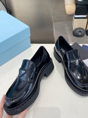 PRADA 26S LOAFERS IN BLACK CALFSKIN WITH LOGO SILVER HARDWARE