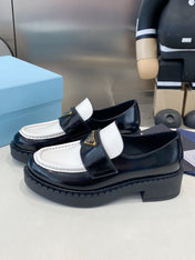 PRADA 26S LOAFERS IN BLACK AND WHITE CALFSKIN WITH LOGO