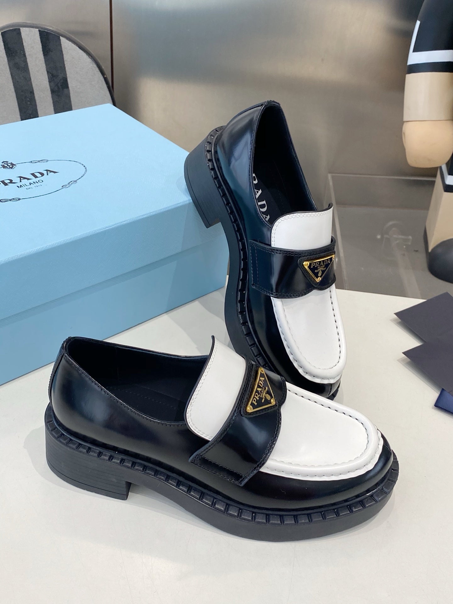 PRADA 26S LOAFERS IN BLACK AND WHITE CALFSKIN WITH LOGO