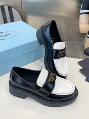 PRADA 26S LOAFERS IN BLACK AND WHITE CALFSKIN WITH LOGO