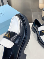 PRADA 26S LOAFERS IN BLACK AND WHITE CALFSKIN WITH LOGO