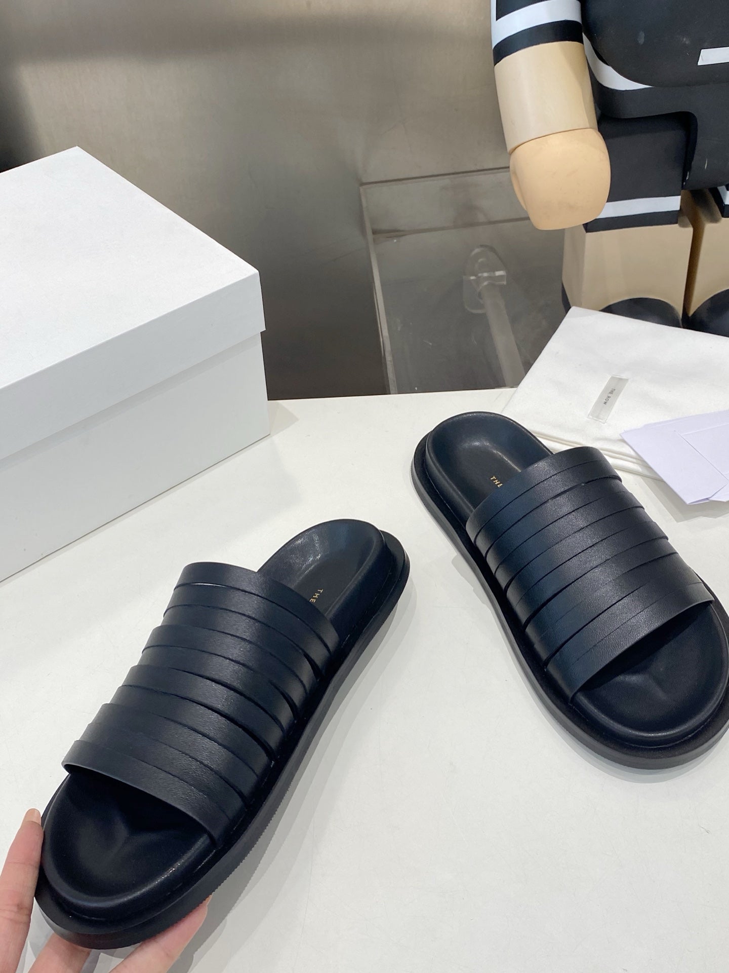 THE ROW 26S MULTI STRAP SLIDES IN BLACK CALFSKIN