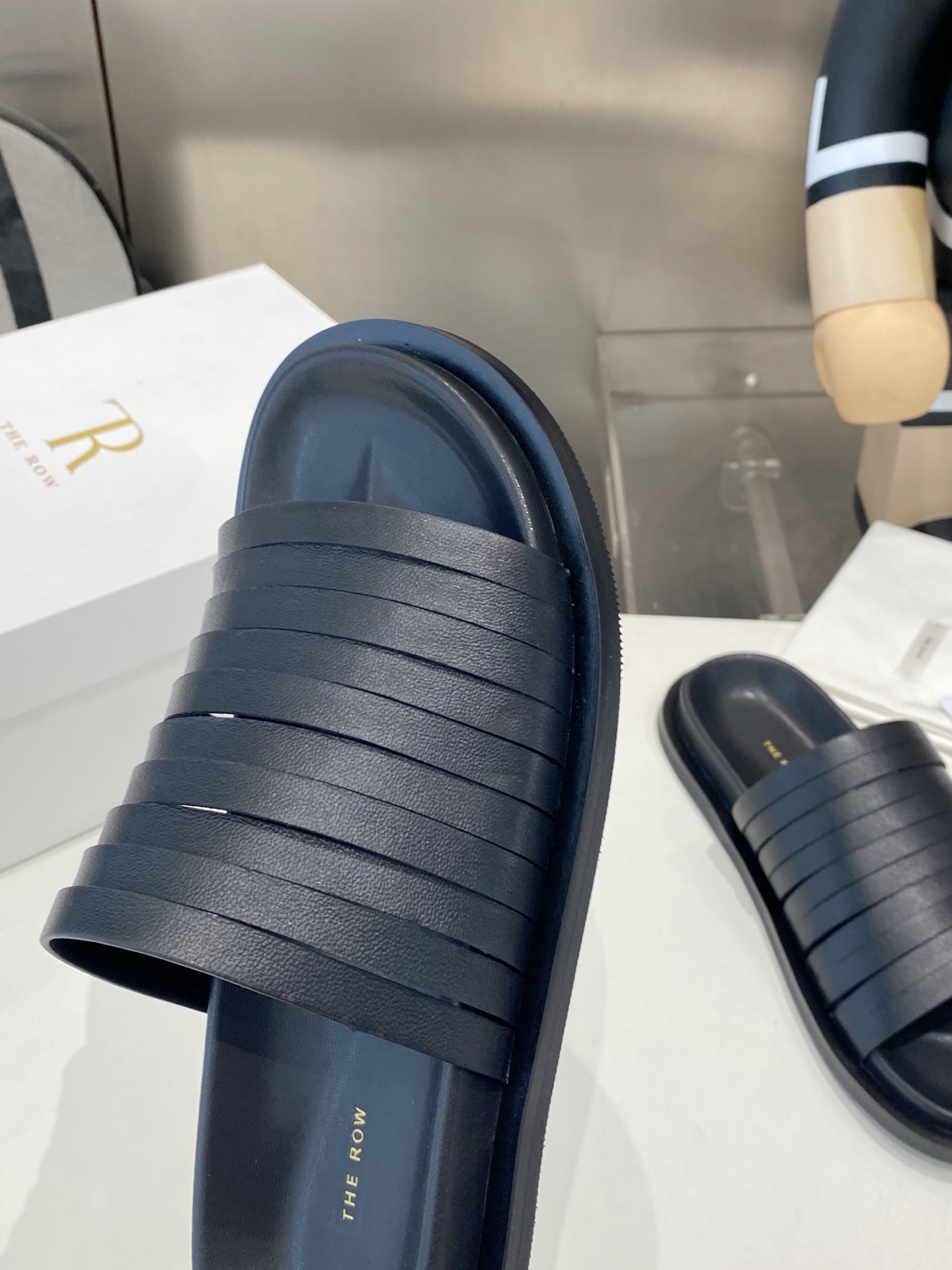 THE ROW 26S MULTI STRAP SLIDES IN BLACK CALFSKIN