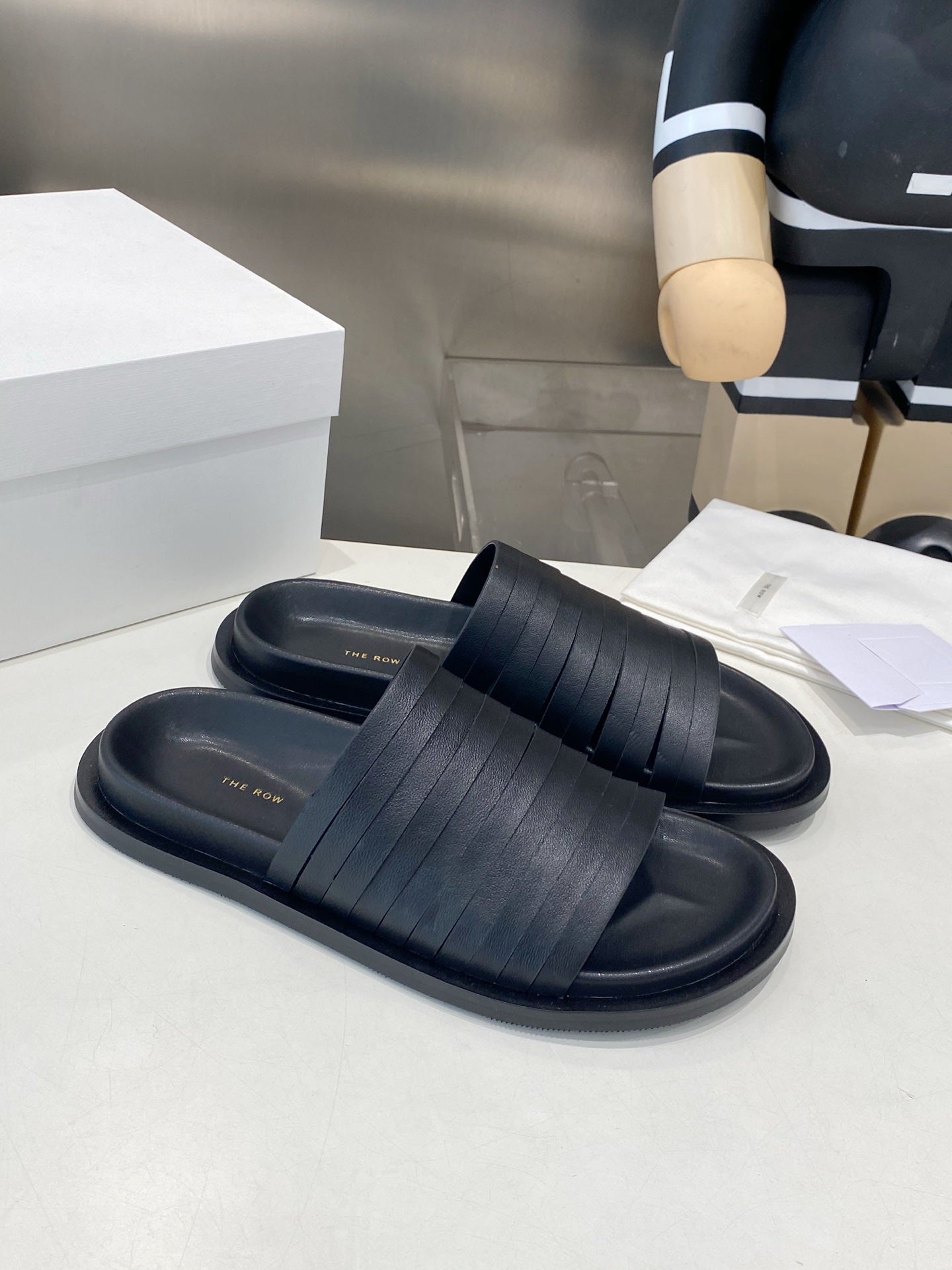 THE ROW 26S MULTI STRAP SLIDES IN BLACK CALFSKIN