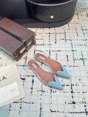 ALAIA FLAT SLINGBACK IN LIGHT BLUE PATENT CALFSKIN AND FILM