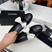 CHANEL 25S MARY JANES IN BLACK CALFSKIN WITH WHITE BOW GOLD HARDWARE