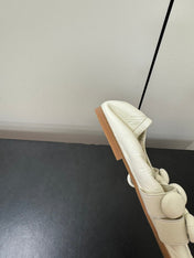 ALAIA SPHERE BALLET FLATS IN WHITE LAMBSKIN