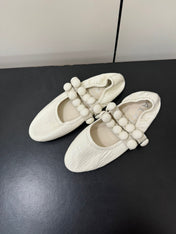 ALAIA SPHERE BALLET FLATS IN WHITE LAMBSKIN