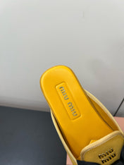 BOW MULES IN DUST YELLOW SUEDE