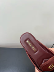 BOW MULES IN RED BROWN SHEEPSKIN